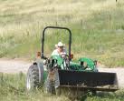 mowing, not me in the cowboy hat